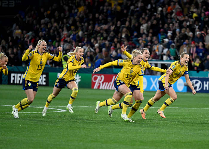 Sweden players pictured celebrating after beating the USA in a penalty shootout at the 2023 FIFA Women's World Cup